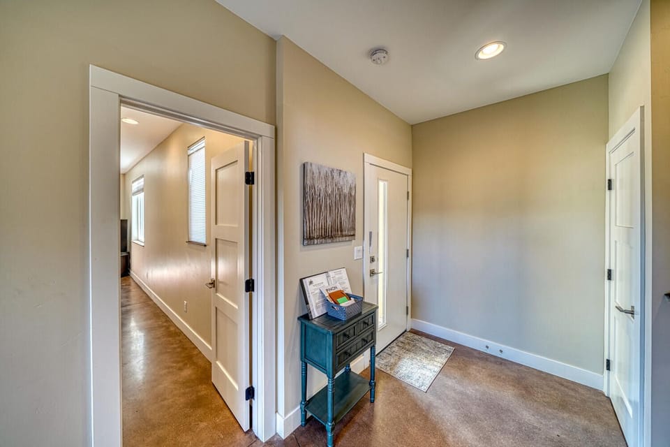Enter the house through the garage and walk into a spacious mud room. One king bedroom suite is located on this level