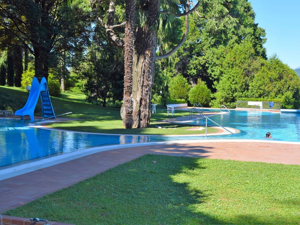 Water, Plant, Tree, Blue, Swimming Pool, Shade, Grass, Sky, Outdoor Furniture, Leisure