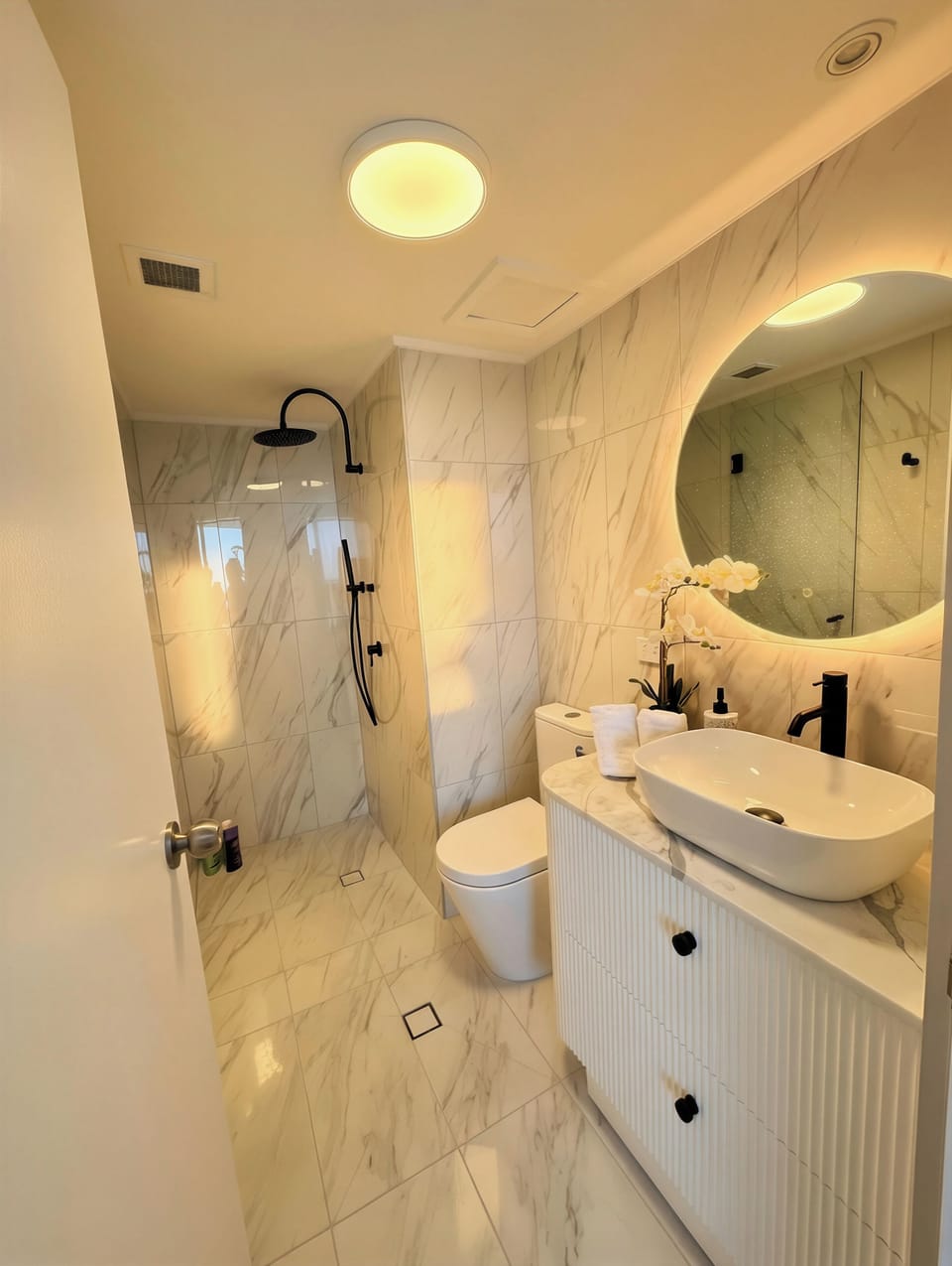 Contemporary bathroom with sleek finishes and essential amenities