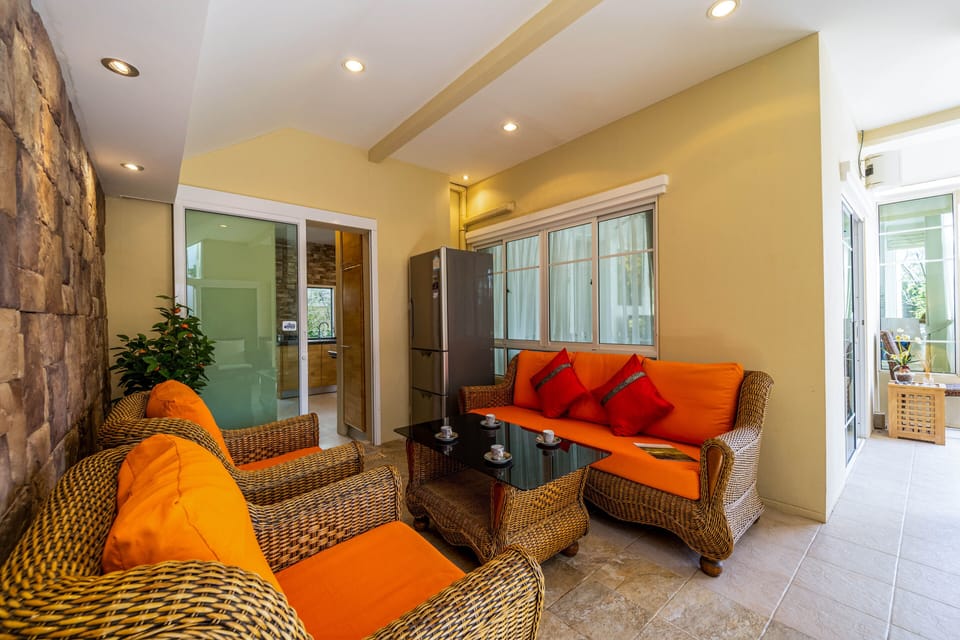 Deluxe Villa | Living area | 40-inch LCD TV with cable channels, TV