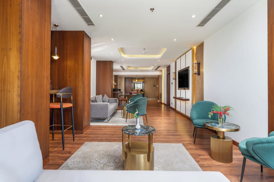 Luxury Suite | Living area | 52-inch LED TV with satellite channels, TV, fireplace