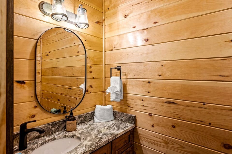Half-bathroom located just inside the front door, off the living room and kitchen area.