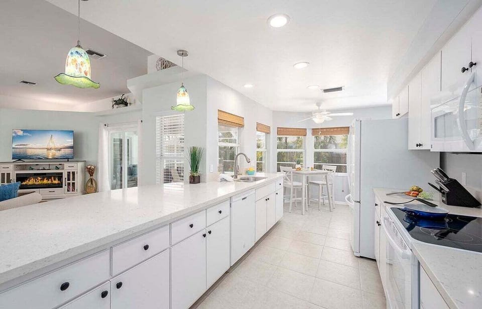 Kitchen has Views to the Pool Area and a Small Nook Area for a Quick Bite