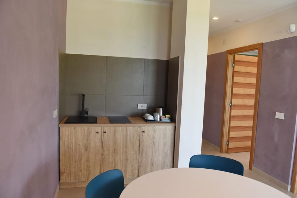 Deluxe Apartment, 1 Double Bed, Pool Access, Sea View | Minibar, in-room safe, soundproofing, free WiFi