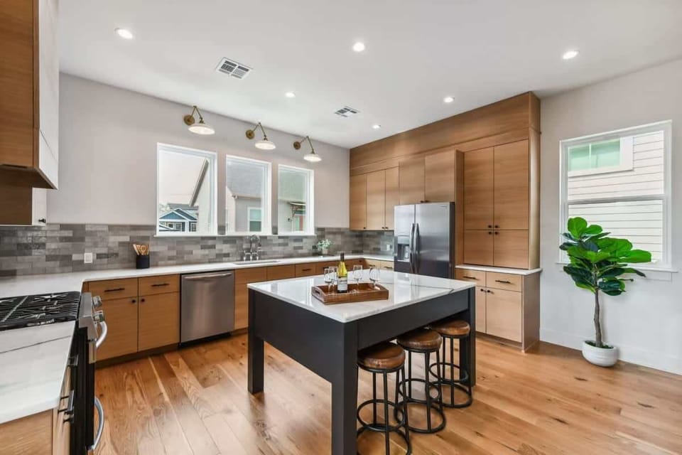 Modern Kitchen features 3-person bar