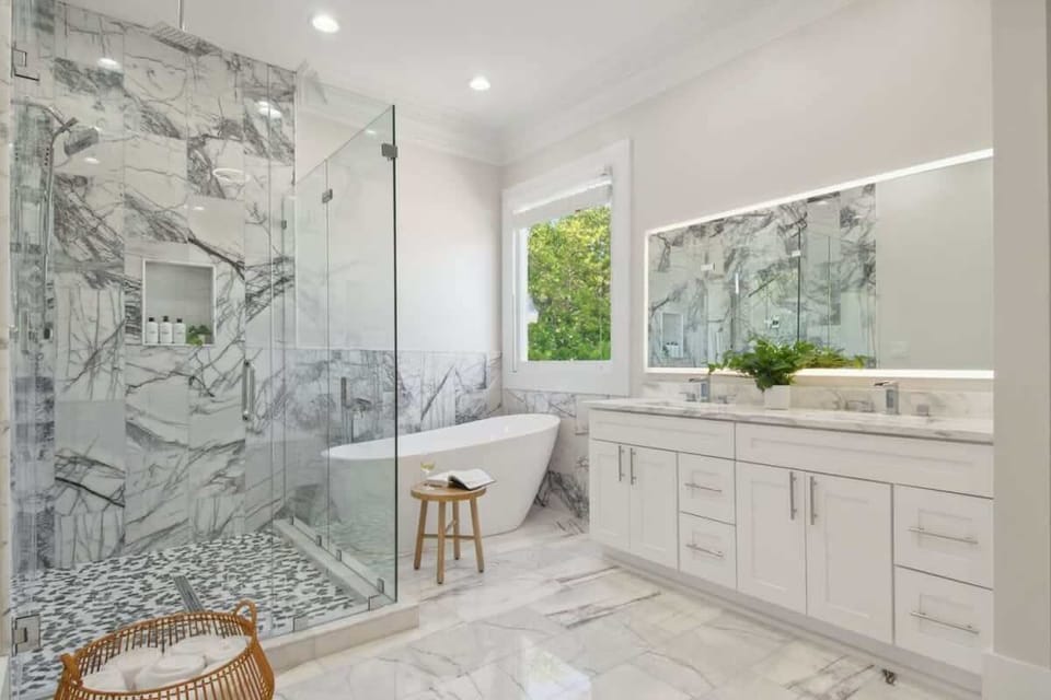 Bedroom 1: Ensuite Bathroom with Double Vanity, Walk-in Shower, & Bathtub