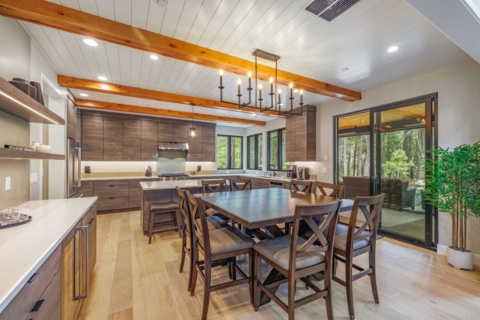 Dining Room - Kitchen – Wood Table + Statement Lighting for Hosting + Open Flow to Kitchen