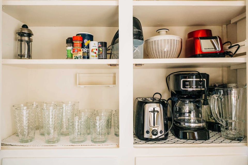 Coffee maker and essentials in one convenient spot.