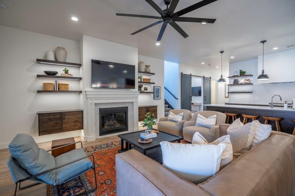 Main floor living room - comfy sofa seating, fireplace, and TV