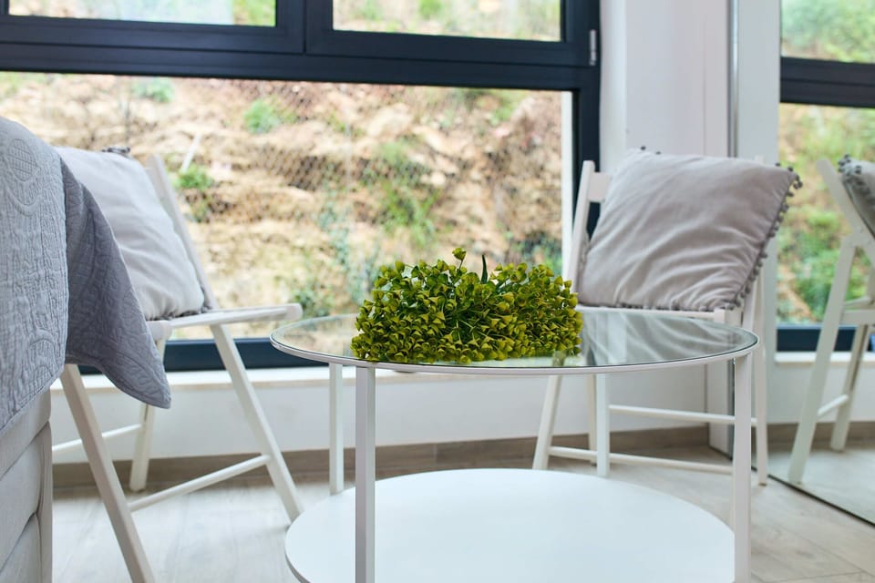 Apartment (0 Bedroom) | Living area | 140-cm flat-screen TV with cable channels, TV