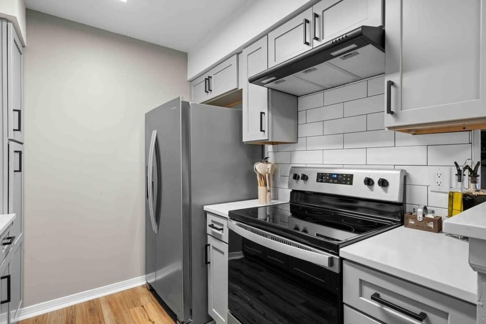 Kitchen view to dining room. All new cabinets and quartz counters. Stainless steel appliances, microwave, toaster, keurig coffee maker. Deep sink. Faucet with spray nozzle. Dishwasher
