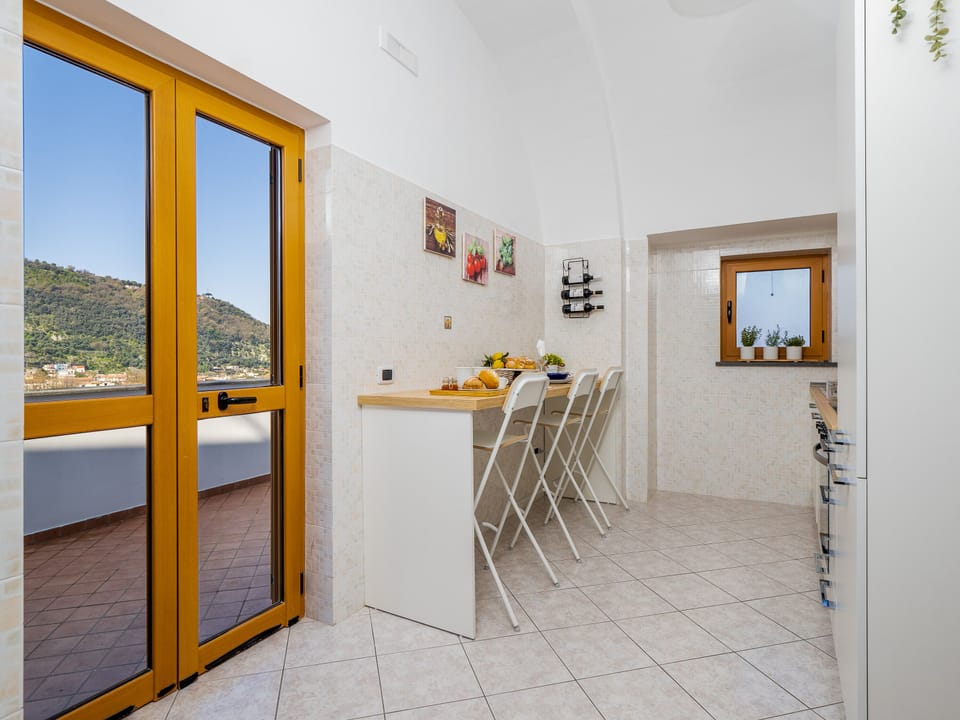 Panoramic Apartment | Private kitchen | Full-size fridge, oven, stovetop, cookware/dishes/utensils