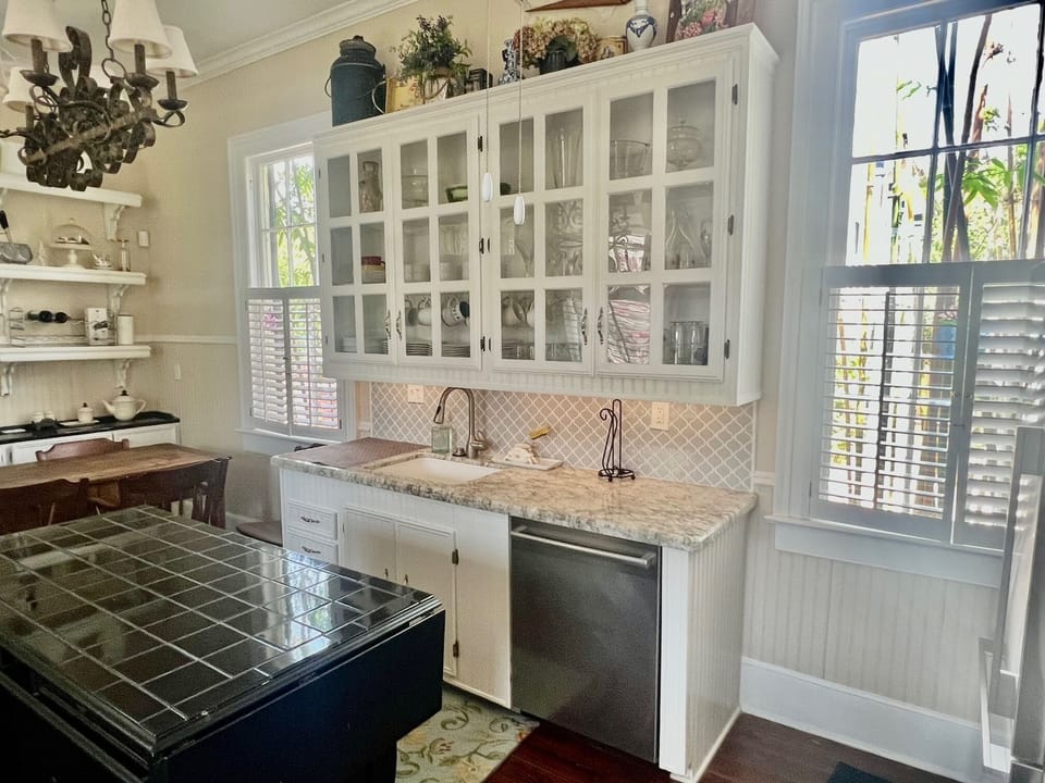 Well stocked kitchen with breakfast table.