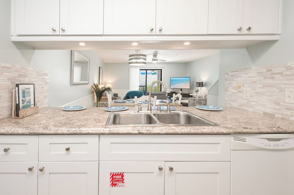 Open kitchen with counter seating. 