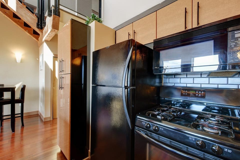 Cook with joy using top-tier appliances, including a gas-style range and built-in microwave.