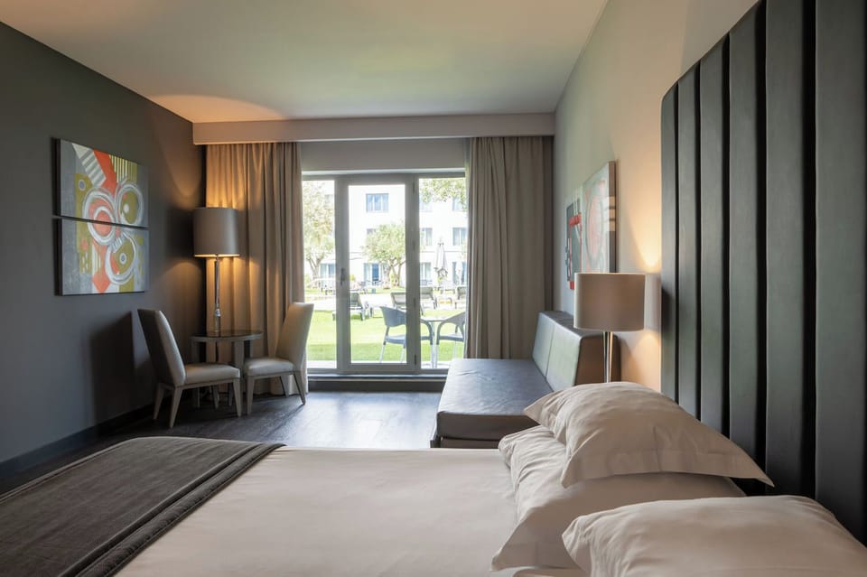 Family Room, Balcony | Minibar, in-room safe, desk, blackout drapes