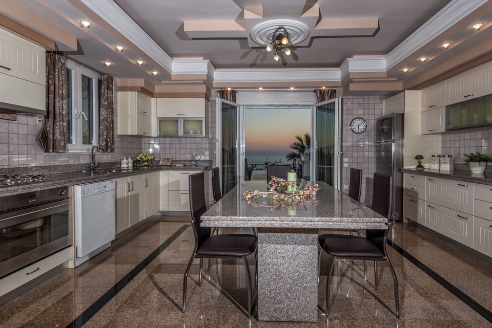 Villa, 5 Bedrooms, Balcony, Garden View | Private kitchen | Coffee/tea maker, dining tables