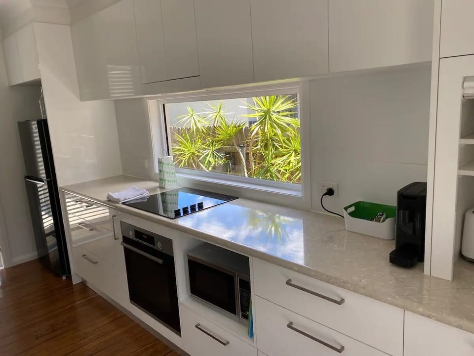Full size kitchen. 1 way mirror on window for privacy.