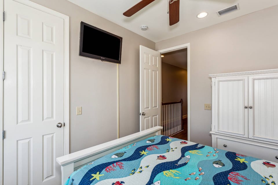 Comfortable queen bedroom with TV