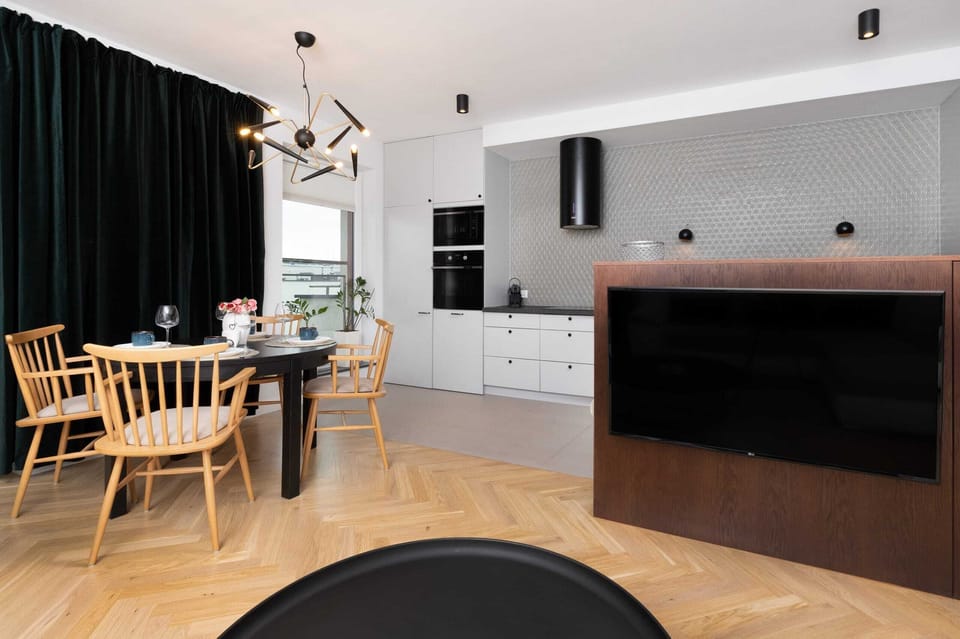 A close-up of a modern kitchen sink and countertop, adorned with premium toiletries and accessories. Practicality meets style.