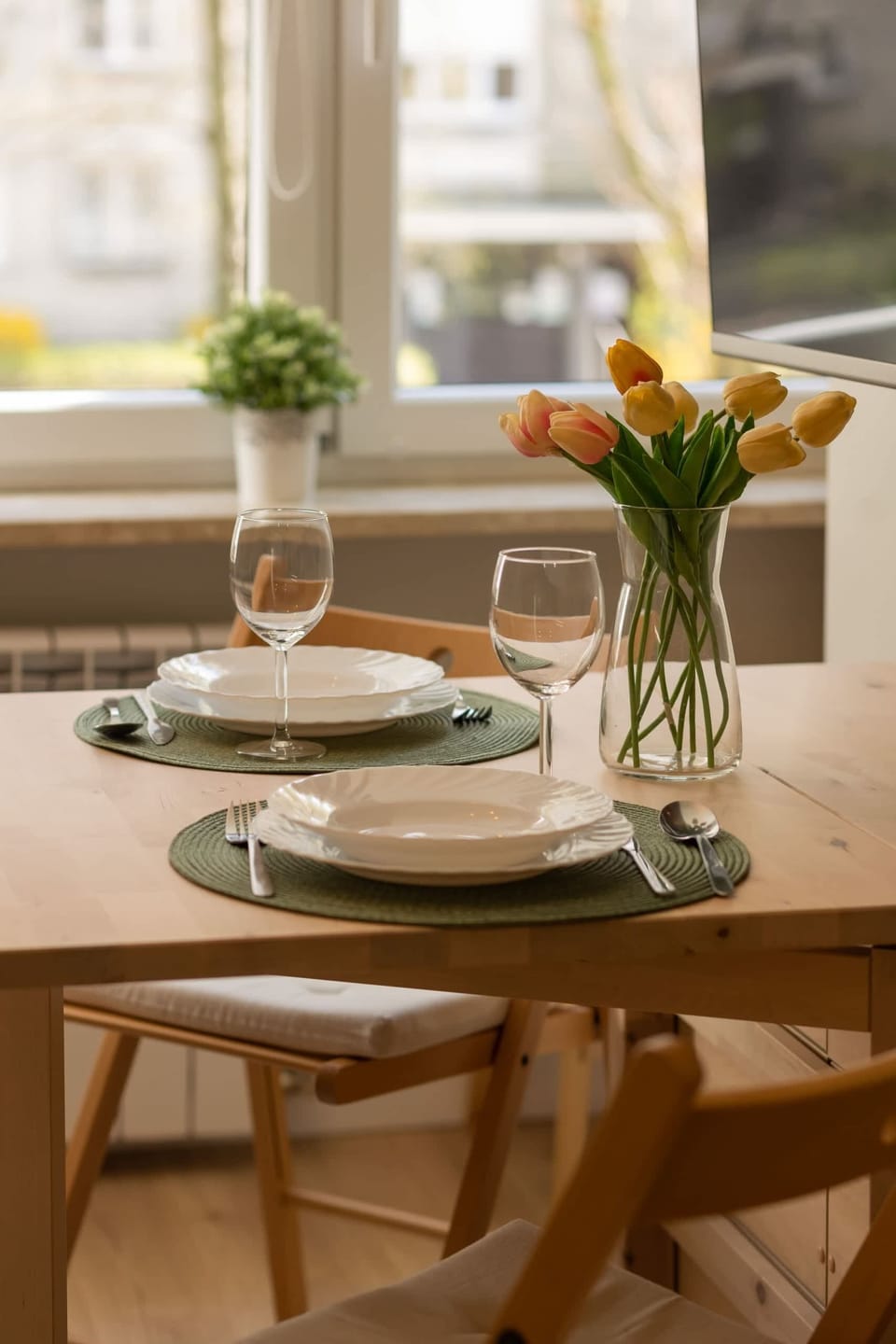 Large table with chairs for eating communal meals. 