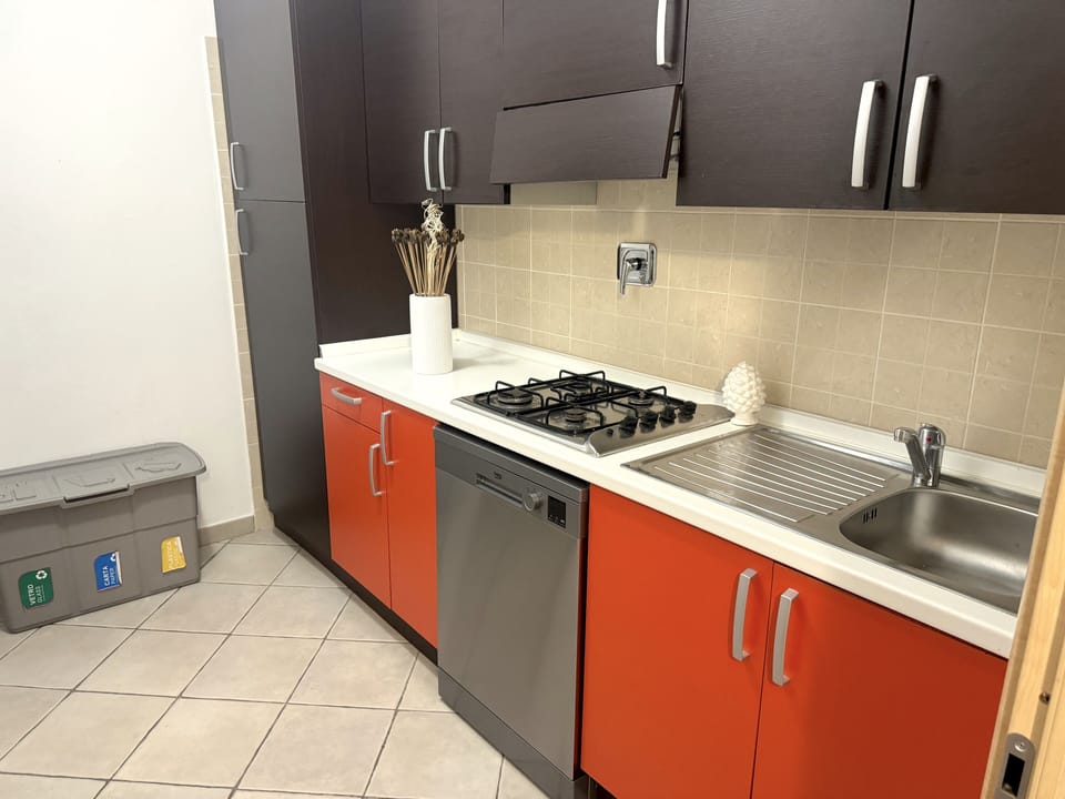 Full-size fridge, microwave, cookware/dishes/utensils