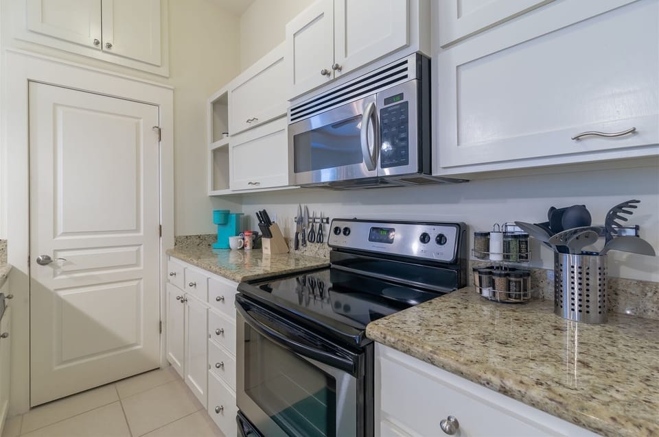Granite countertops and stainless steel gourmet kitchen
