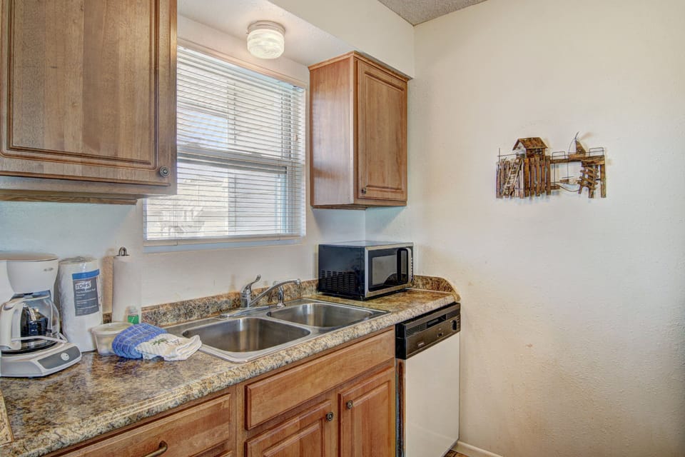Your fully equipped kitchen features granite counters, stainless steel appliances, and everything you need to prepare memorable meals during your stay.