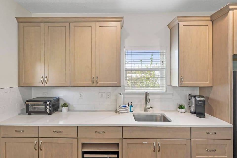 Toaster oven, microwave and keurig in kitchen