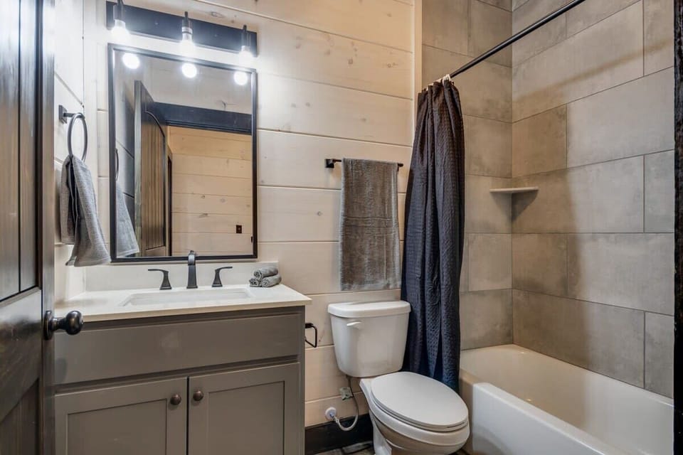 Large tiled showers with shampoo, conditioners, and body wash supplied.