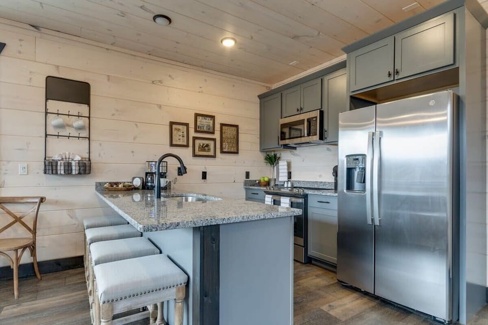 Galley style kitchen with island seating for an enjoyable food preparation area. 