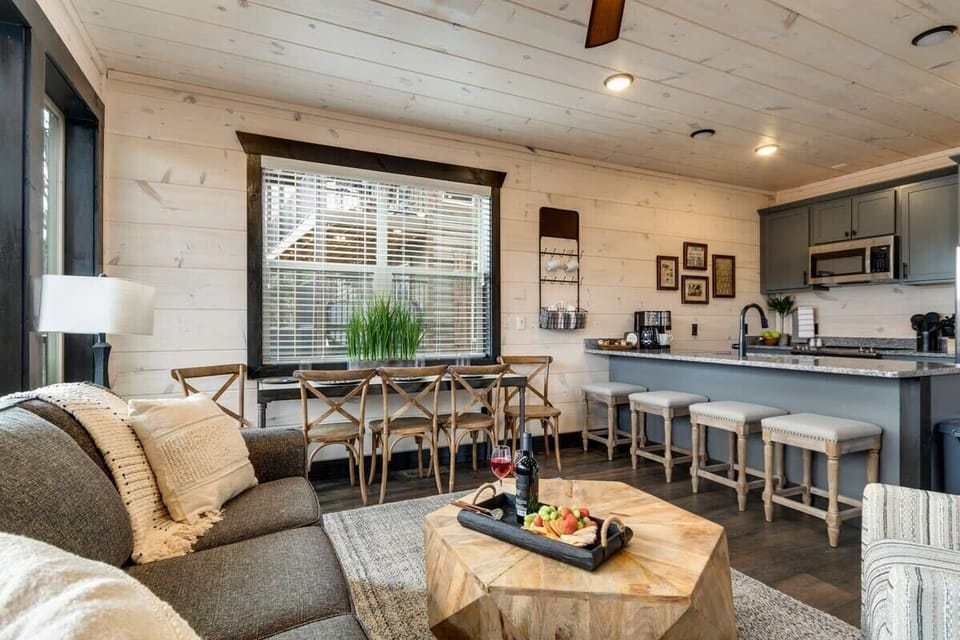 Galley style kitchen with island seating for an enjoyable food preparation area.