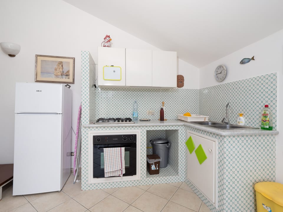 Panoramic Apartment | Private kitchen | Full-size fridge, stovetop, electric kettle, cookware/dishes/utensils