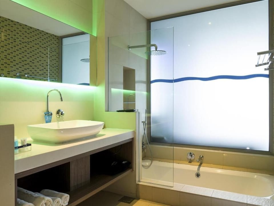 Bathtub, eco-friendly toiletries, hair dryer, bathrobes