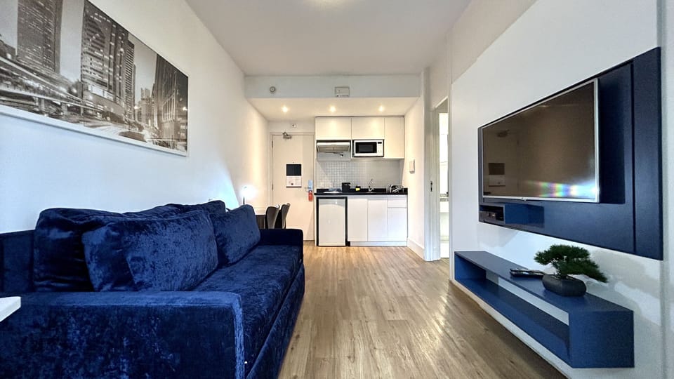 Deluxe Studio | Living area | Flat-screen TV