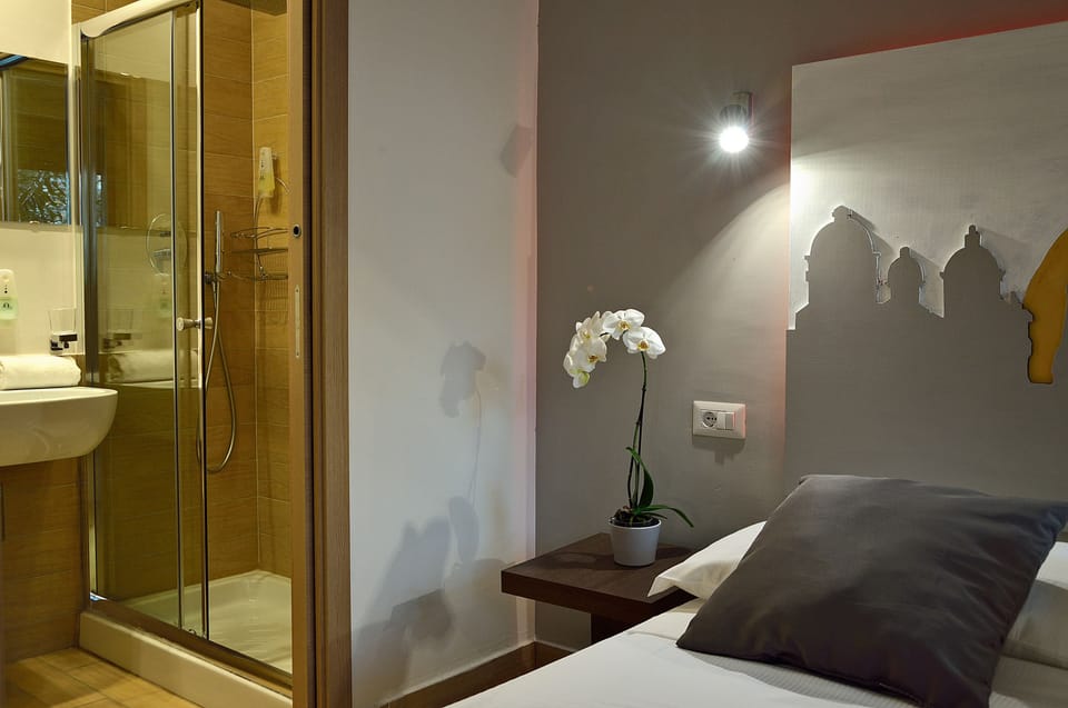 Double or Twin Room | Minibar, in-room safe, desk, iron/ironing board