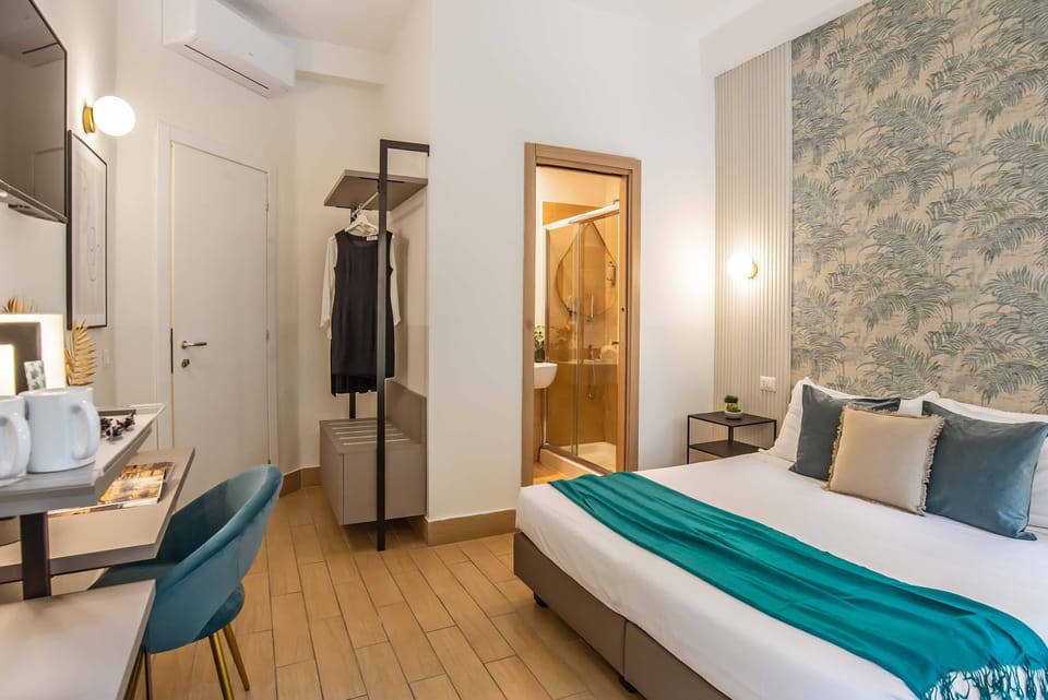 Double or Twin Room | Minibar, in-room safe, desk, iron/ironing board