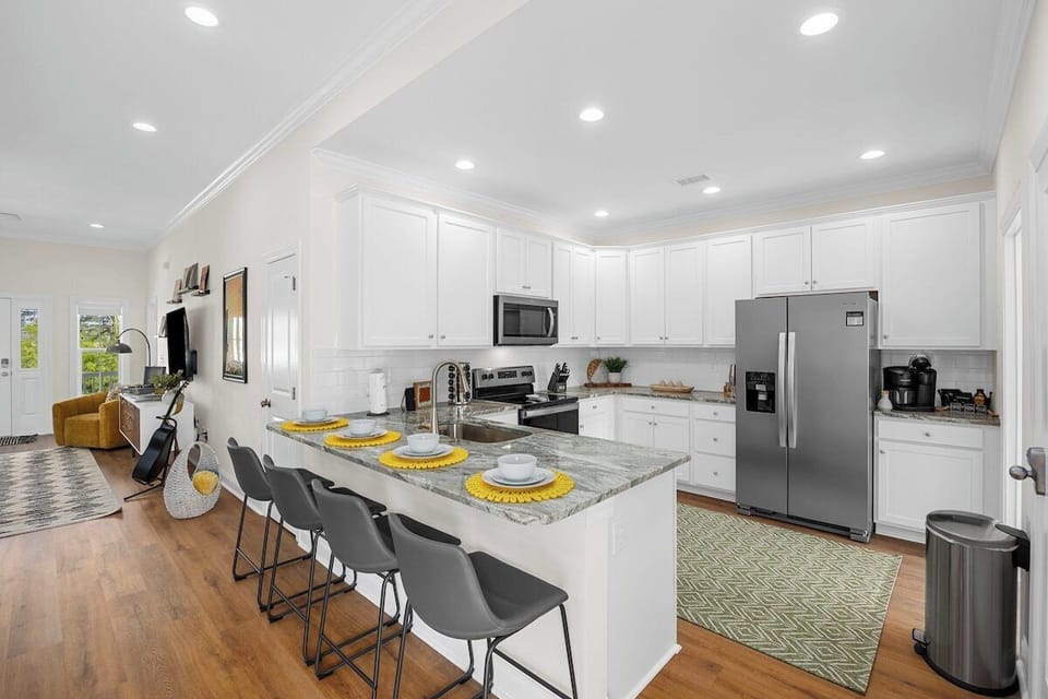 Discover the culinary hub of our home in the well-equipped kitchen, complete with a stylish center island