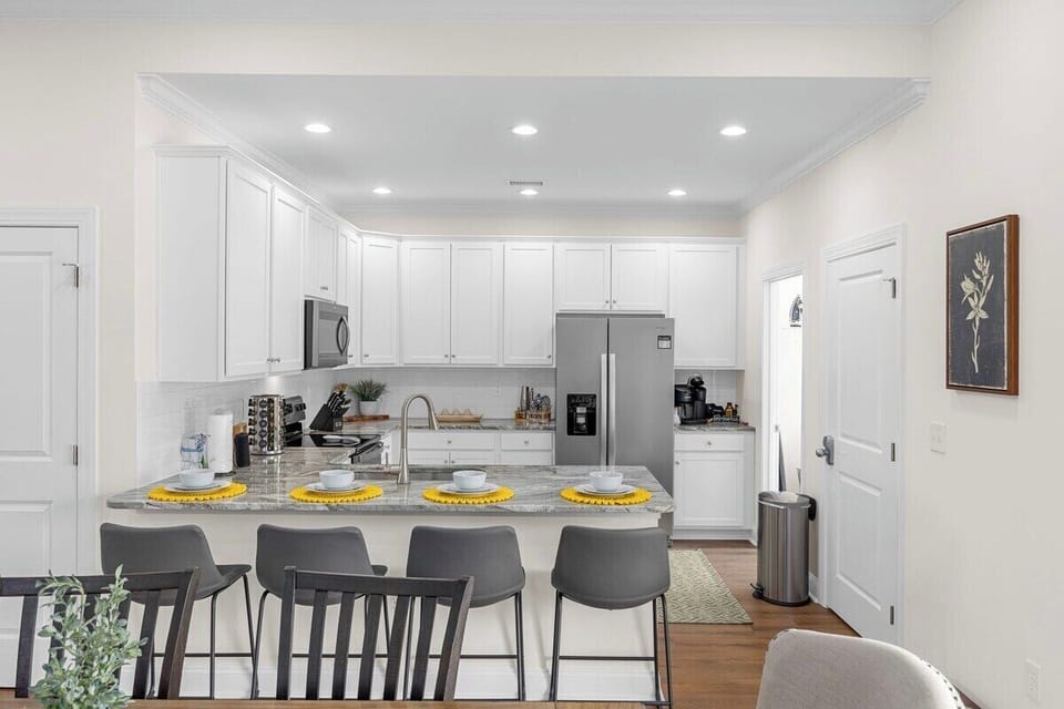 Whether you're preparing gourmet feasts, experimenting with new recipes, or simply enjoying the art of cooking, our kitchen with a center island offers functionality and style