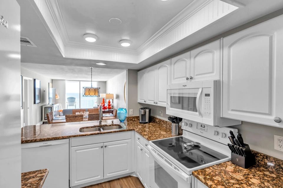 Fully equipped kitchen w/ ample counter space, great for cooking at home.