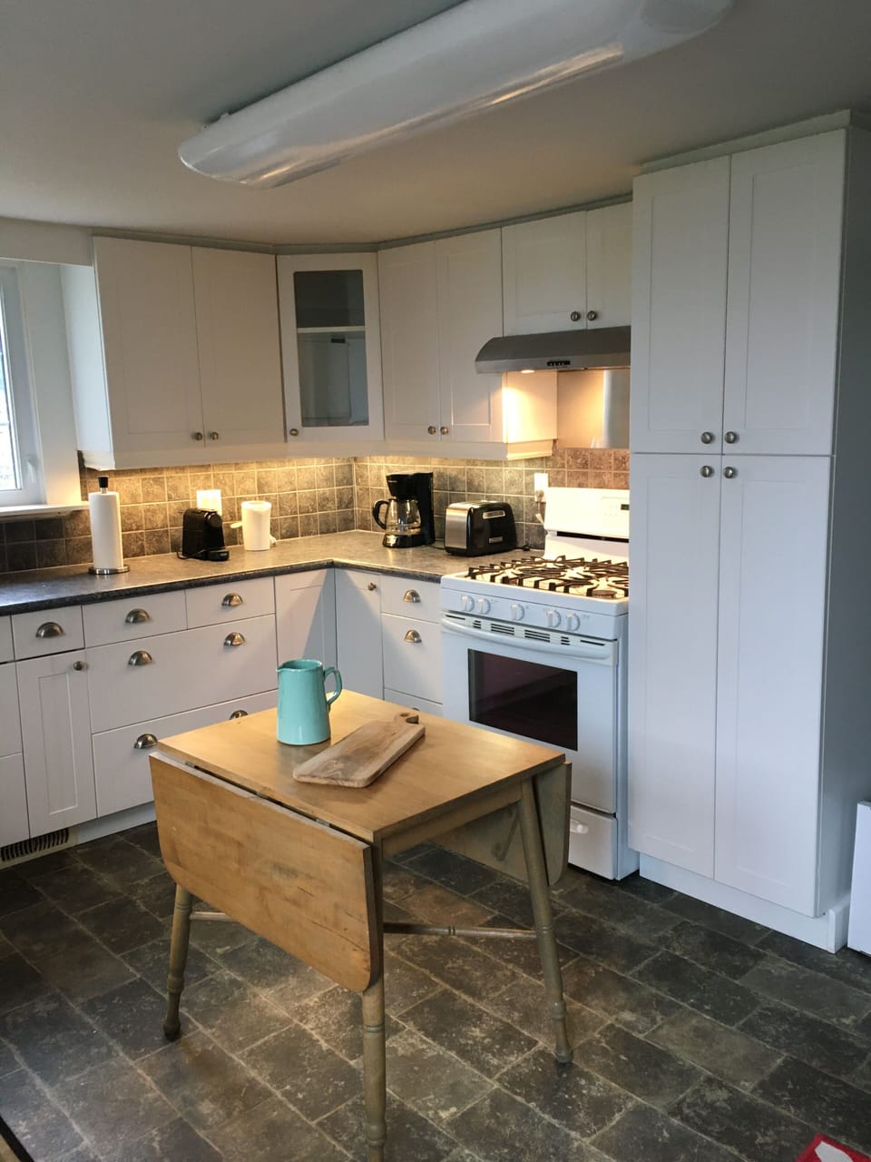 full kitchen, various coffee makers, some coffee provided milk frother, tea pots