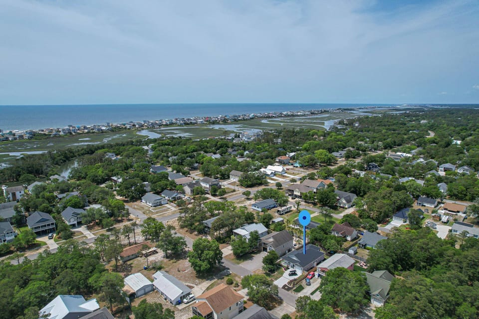Looking SW. Ocean in the background & the Davis Canal/Marshlands between the Wooded Section & the Beachfront.