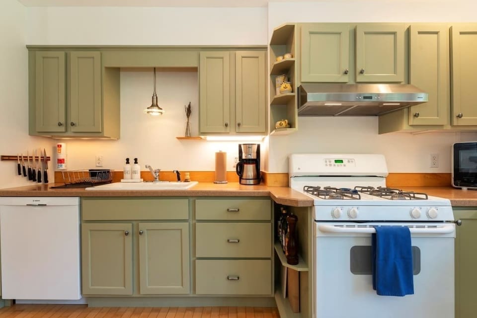 Cheery, well-stocked kitchen.