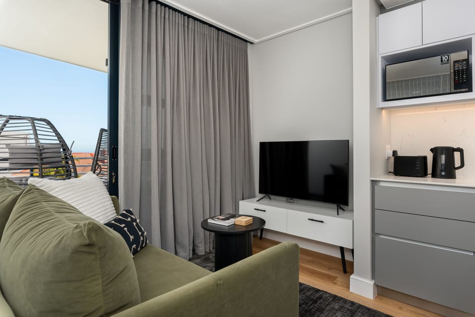 Gallery Apartment | Living area | 50-inch flat-screen TV with cable channels, TV, Netflix