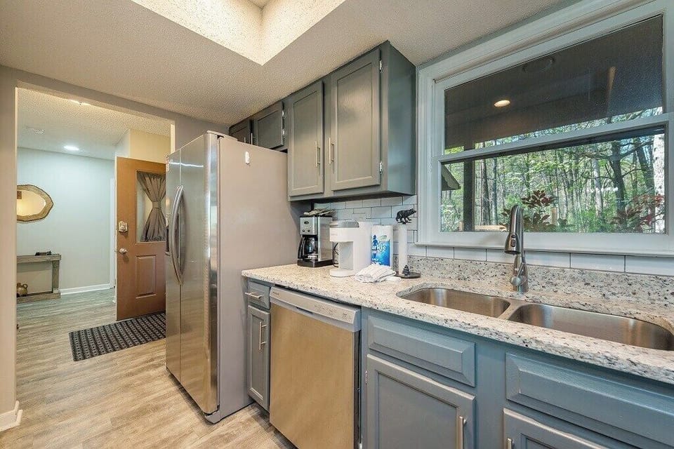 Coffee maker and window providing great kitchen lighting