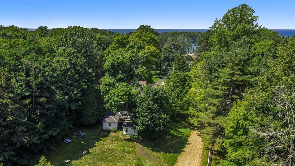Coastal Cottage is so close to Lake Michigan you can hear it and even catch glimpses of sunsets from the sunroom