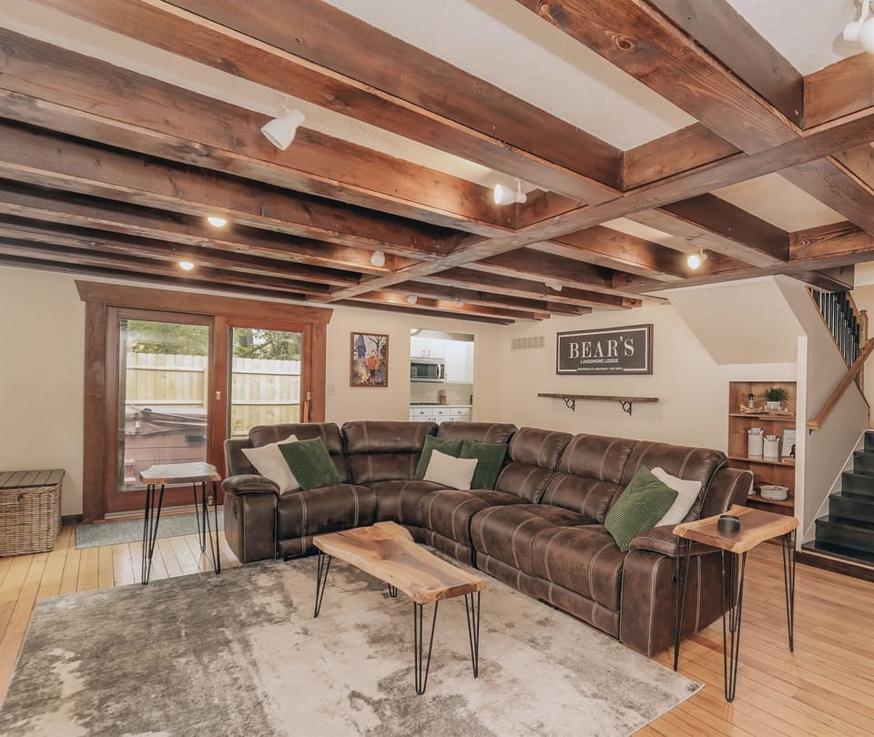 Get cozy! The living room really gives the “lodge feel” to the home. This cozy space is complete with a spacious sectional sofa and a 75” smart TV, making it the perfect spot to kick back and enjoy a movie! 