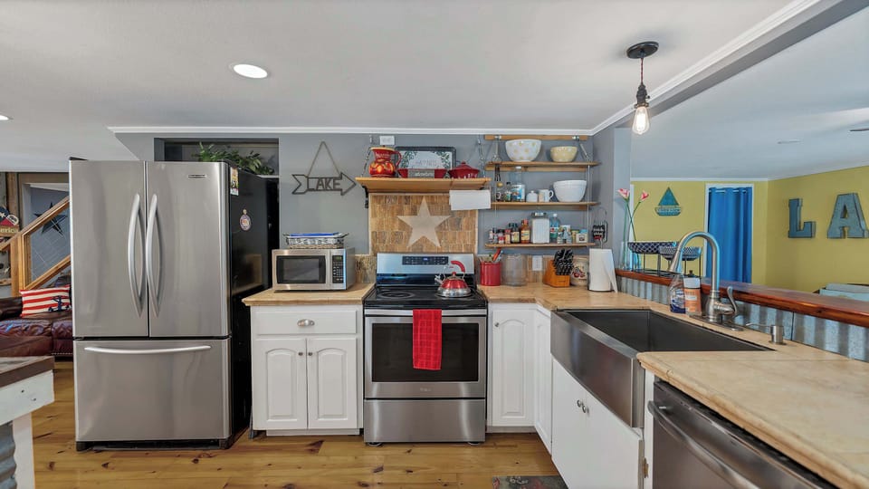 All the kitchen appliances you will need to cook your family their favorite meals. Full-size refrigerator with a freezer, microwave, stove, farm sink, dishwasher, etc...
