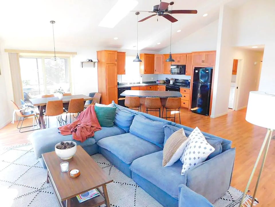 Open-concept living, dining, and kitchen space designed for connection, comfort, and lakefront living.