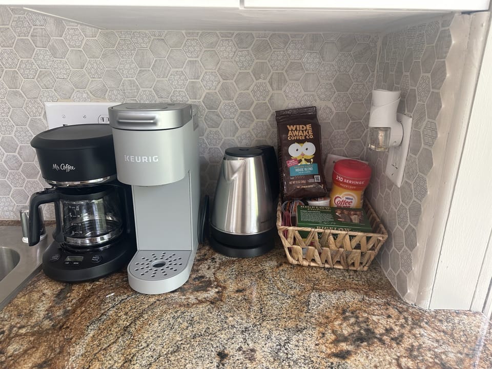 Coffee and tea bar includes a Mr. Coffee, a Keurig and an electric tea kettle